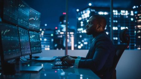 business man sitting in front of the computer